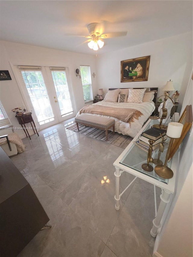 117 SW Fairview Ave, Port St Lucie, FL 34983 - bedroom featuring french doors, access to outside, marble finish flooring, and a ceiling fan