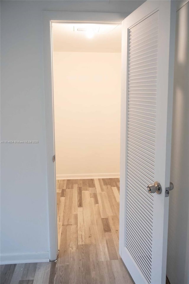 251 NW 76th Ave Unit 208, Margate, FL 33063 - hallway featuring wood finished floors and baseboards