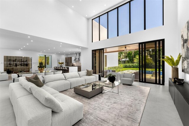 6200 Moss Ranch Rd, Pinecrest, FL 33156 - living area with a high ceiling, recessed lighting, and finished concrete floors
