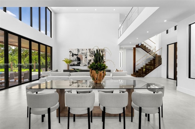 6200 Moss Ranch Rd, Pinecrest, FL 33156 - dining area with a towering ceiling, stairway, french doors, and recessed lighting