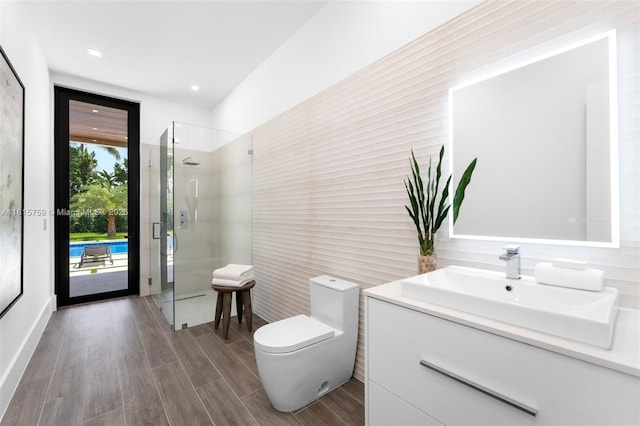 6200 Moss Ranch Rd, Pinecrest, FL 33156 - full bath with vanity, a shower with shower door, tile walls, toilet, and wood finished floors
