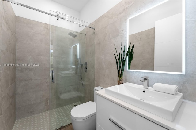 6200 Moss Ranch Rd, Pinecrest, FL 33156 - bathroom featuring a stall shower, vanity, toilet, and tile walls