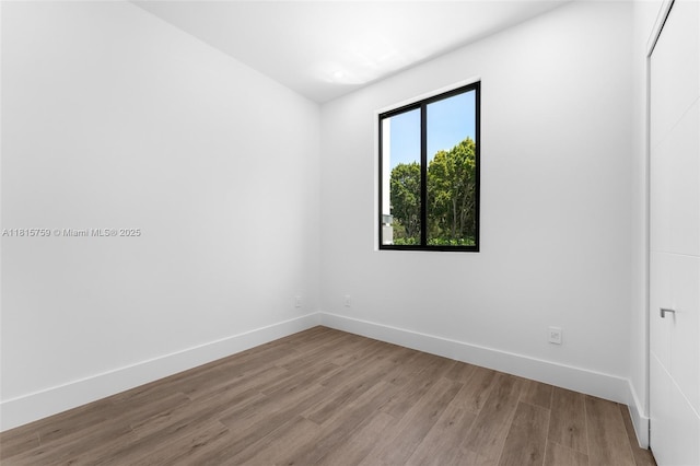 6200 Moss Ranch Rd, Pinecrest, FL 33156 - unfurnished room featuring wood finished floors and baseboards
