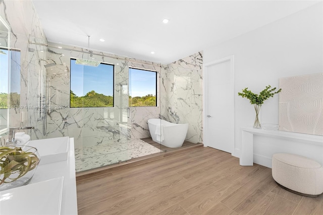 6200 Moss Ranch Rd, Pinecrest, FL 33156 - bathroom with a marble finish shower, a freestanding tub, wood finished floors, vanity, and recessed lighting