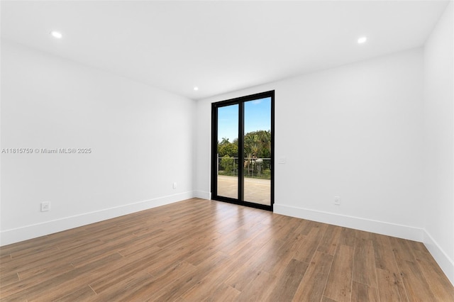 6200 Moss Ranch Rd, Pinecrest, FL 33156 - unfurnished room featuring wood finished floors, baseboards, and recessed lighting
