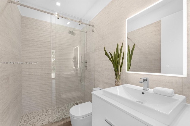 6200 Moss Ranch Rd, Pinecrest, FL 33156 - bathroom with a stall shower, vanity, toilet, and tile walls