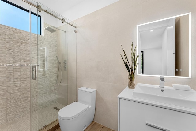 6200 Moss Ranch Rd, Pinecrest, FL 33156 - full bathroom with vanity, a stall shower, tile walls, toilet, and wood finished floors