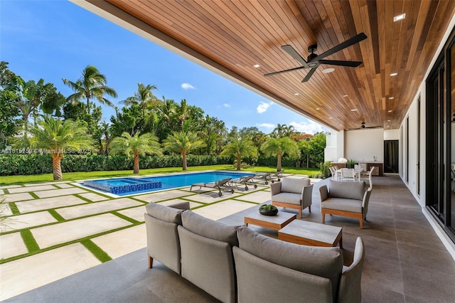 6200 Moss Ranch Rd, Pinecrest, FL 33156 - view of patio with ceiling fan, outdoor dining area, view of wooded area, an outdoor hangout area, and a pool with connected hot tub