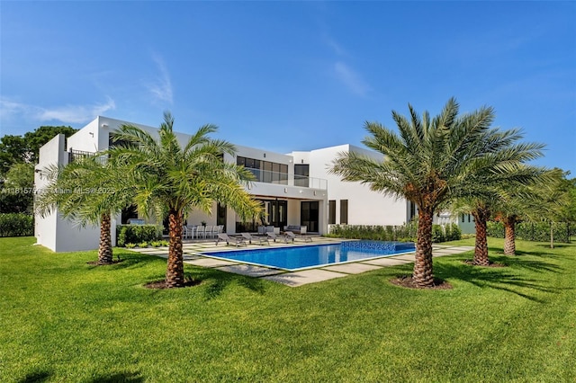 6200 Moss Ranch Rd, Pinecrest, FL 33156 - back of house featuring an outdoor pool, a yard, and stucco siding