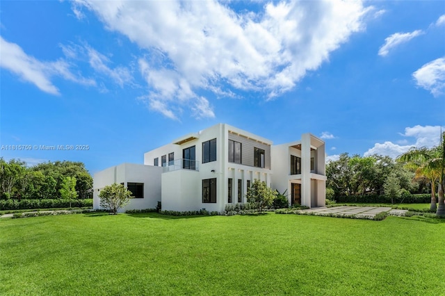 6200 Moss Ranch Rd, Pinecrest, FL 33156 - rear view of property with stucco siding and a lawn