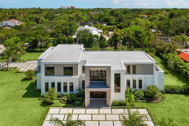 6200 Moss Ranch Rd, Pinecrest, FL 33156 - back of house with stucco siding and a yard