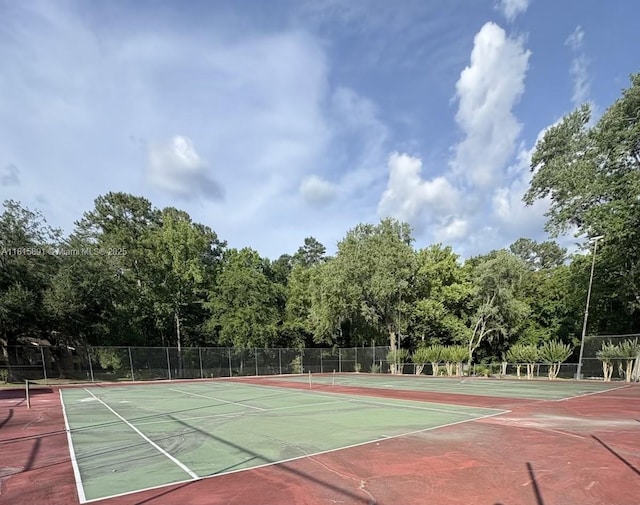 1810 NW 23rd Blvd Unit 103, Gainesville, FL 32605 - view of tennis court featuring community basketball court