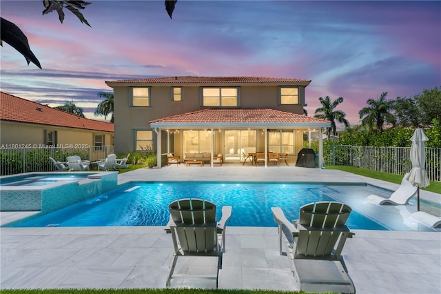 12890 Hyland Cir, Boca Raton, FL 33428 - view of swimming pool with a pool with connected hot tub and a patio area