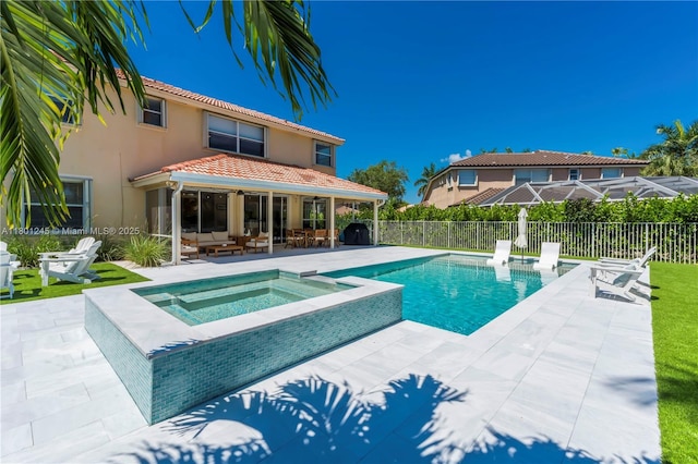 12890 Hyland Cir, Boca Raton, FL 33428 - view of pool with an in-ground hot tub, a patio area, and an outdoor hangout area