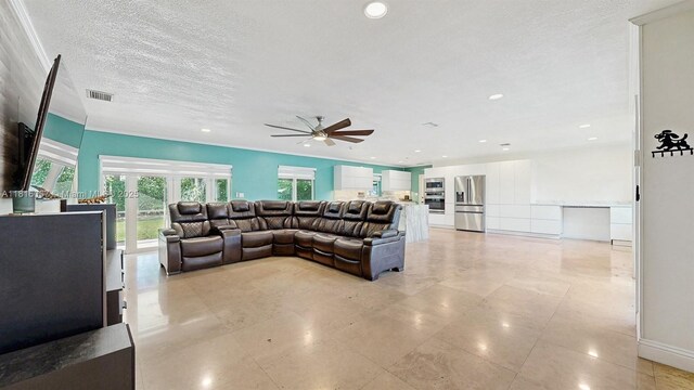 19520 SW 307th St, Homestead, FL 33030 - living room featuring ceiling fan, recessed lighting, and a textured ceiling