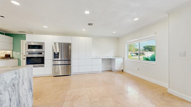 19520 SW 307th St, Homestead, FL 33030 - kitchen featuring appliances with stainless steel finishes, white cabinets, light stone counters, recessed lighting, and modern cabinets