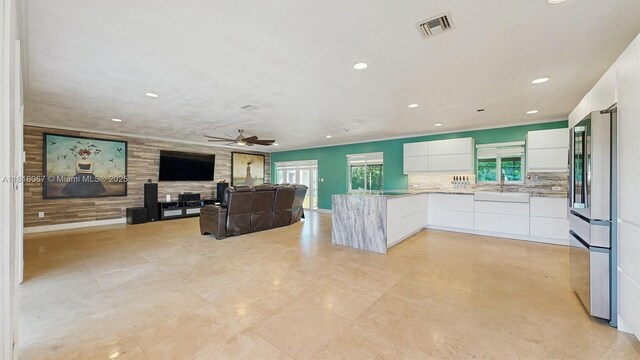 19520 SW 307th St, Homestead, FL 33030 - kitchen with modern cabinets, stainless steel fridge, white cabinets, plenty of natural light, and recessed lighting