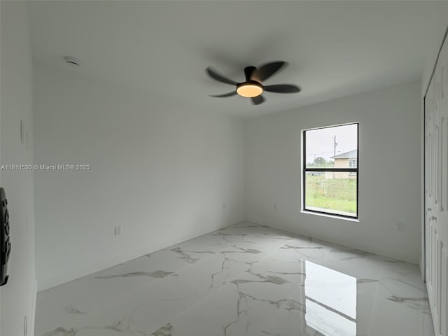 842844 Alabama Rd S, Lehigh Acres, FL 33974 - spare room with ceiling fan and marble finish floors