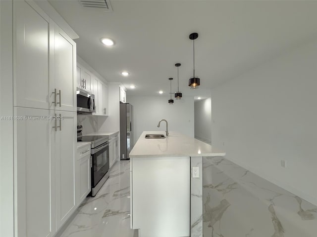 842844 Alabama Rd S, Lehigh Acres, FL 33974 - kitchen with appliances with stainless steel finishes, a sink, light marble finish flooring, recessed lighting, and white cabinets