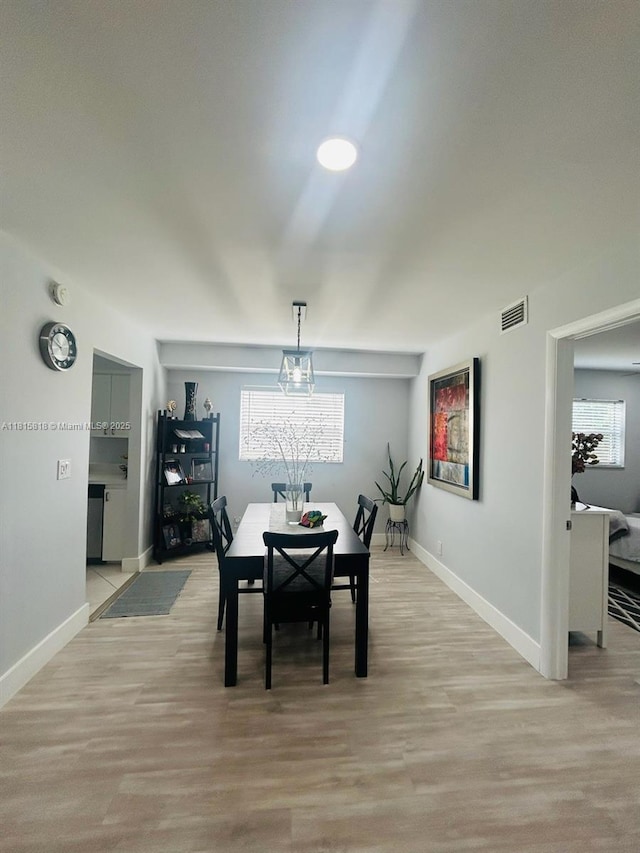 8002 Lagos De Campo Blvd Unit B-107, Tamarac, FL 33321 - dining room featuring baseboards and light wood finished floors