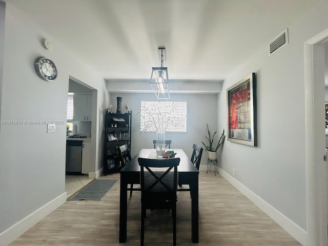 8002 Lagos De Campo Blvd Unit B-107, Tamarac, FL 33321 - dining room with healthy amount of natural light, baseboards, and light wood finished floors