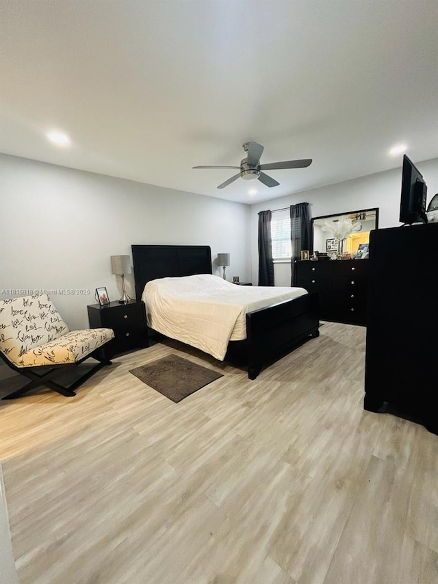 8002 Lagos De Campo Blvd Unit B-107, Tamarac, FL 33321 - bedroom featuring light wood-style flooring and a ceiling fan