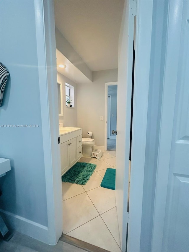 8002 Lagos De Campo Blvd Unit B-107, Tamarac, FL 33321 - bathroom with toilet, tile patterned flooring, vanity, and baseboards