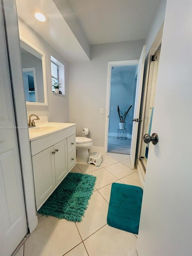 8002 Lagos De Campo Blvd Unit B-107, Tamarac, FL 33321 - bathroom featuring tile patterned flooring, vanity, toilet, and baseboards