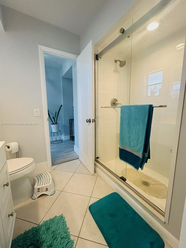 8002 Lagos De Campo Blvd Unit B-107, Tamarac, FL 33321 - full bathroom with a shower stall, tile patterned flooring, toilet, and vanity