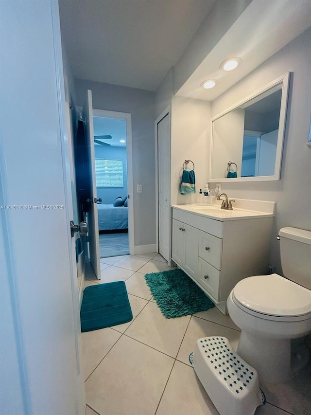 8002 Lagos De Campo Blvd Unit B-107, Tamarac, FL 33321 - bathroom featuring vanity, toilet, ensuite bath, tile patterned flooring, and baseboards