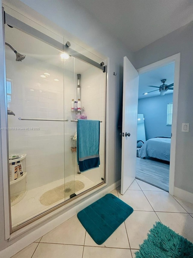 8002 Lagos De Campo Blvd Unit B-107, Tamarac, FL 33321 - ensuite bathroom featuring tile patterned floors, a shower stall, and baseboards