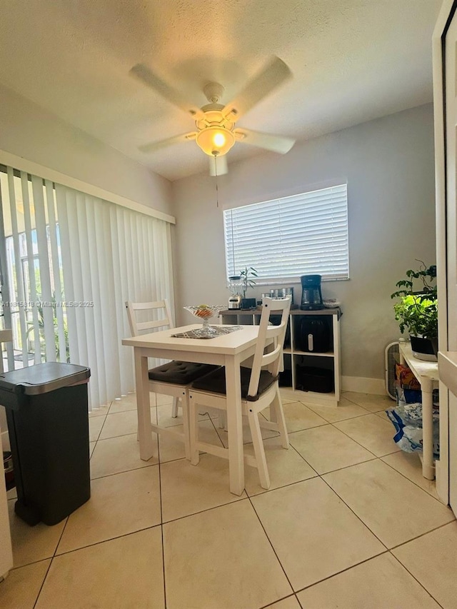 8002 Lagos De Campo Blvd Unit B-107, Tamarac, FL 33321 - dining area with a ceiling fan, light tile patterned floors, and a textured ceiling