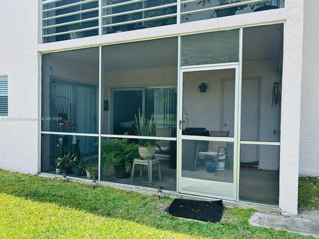 8002 Lagos De Campo Blvd Unit B-107, Tamarac, FL 33321 - view of exterior entry featuring stucco siding