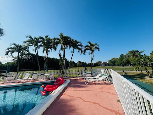 8002 Lagos De Campo Blvd Unit B-107, Tamarac, FL 33321 - community pool featuring a patio area