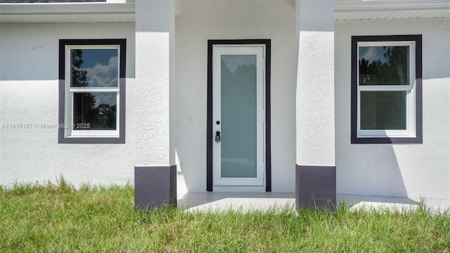 1351 Sulstone Dr, Punta Gorda, FL 33983 - doorway to property with stucco siding