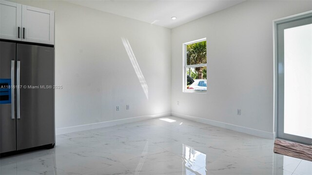 1351 Sulstone Dr, Punta Gorda, FL 33983 - empty room featuring baseboards, light marble finish flooring, and recessed lighting