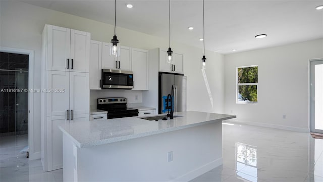 1351 Sulstone Dr, Punta Gorda, FL 33983 - kitchen with appliances with stainless steel finishes, a sink, light marble finish floors, white cabinetry, and a center island with sink