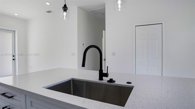 1351 Sulstone Dr, Punta Gorda, FL 33983 - kitchen with a sink, light stone countertops, pendant lighting, and recessed lighting