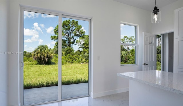 1351 Sulstone Dr, Punta Gorda, FL 33983 - doorway with baseboards and light marble finish floors