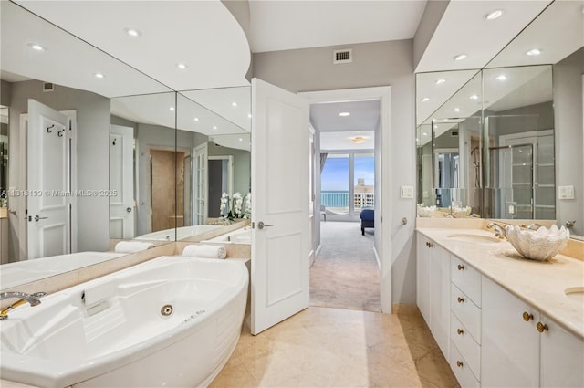 781 Crandon Blvd Unit 1802, Key Biscayne, FL 33149 - bathroom with double vanity, a jetted tub, marble finish floors, recessed lighting, and a stall shower