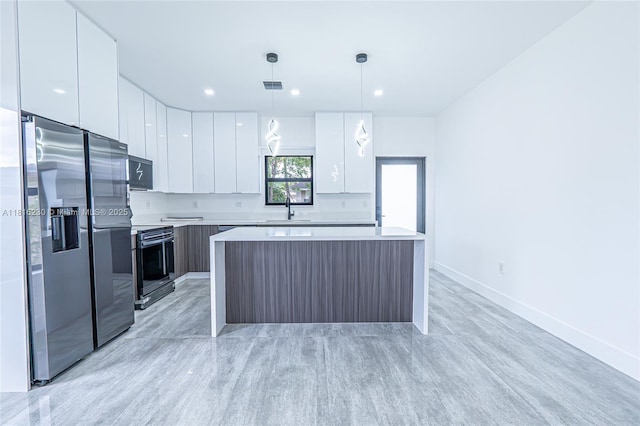 2725 NW 7th St, Fort Lauderdale, FL 33311 - kitchen with modern cabinets, appliances with stainless steel finishes, white cabinets, light countertops, and recessed lighting