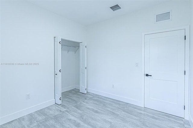 2725 NW 7th St, Fort Lauderdale, FL 33311 - unfurnished bedroom with baseboards and a closet