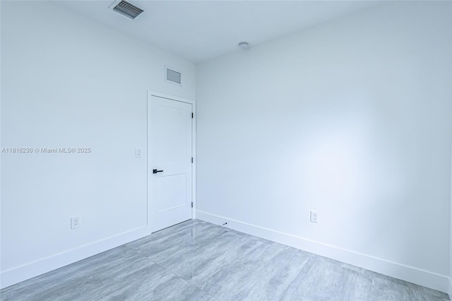 2725 NW 7th St, Fort Lauderdale, FL 33311 - spare room with baseboards and a smoke detector