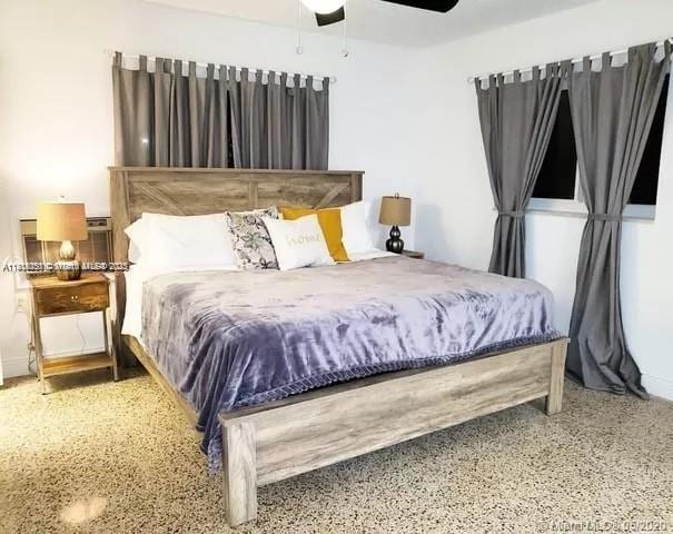 482 NE 8th Ave, Deerfield Beach, FL 33441 - bedroom featuring speckle patterned floor and ceiling fan
