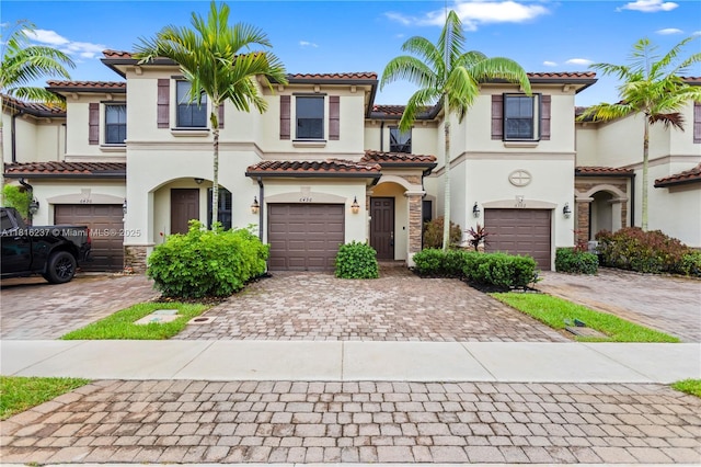 6496 S Anise Ct, Davie, FL 33314 - view of front of property with decorative driveway, stucco siding, and a garage