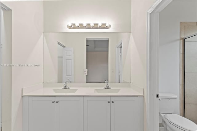 6496 S Anise Ct, Davie, FL 33314 - bathroom featuring double vanity, toilet, and tiled shower