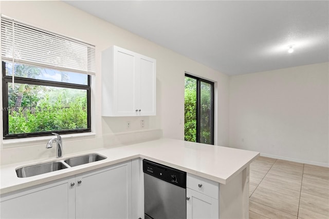 6496 S Anise Ct, Davie, FL 33314 - kitchen featuring stainless steel dishwasher, a sink, a peninsula, and light countertops