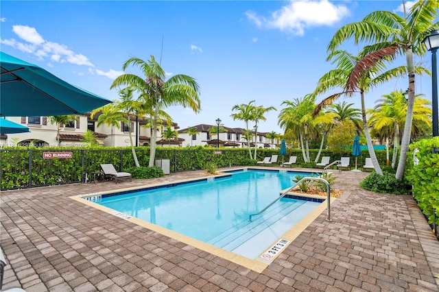 6496 S Anise Ct, Davie, FL 33314 - community pool featuring a patio area
