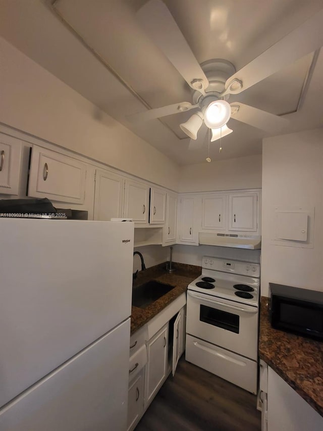 600 Layne Blvd Unit 118, Hallandale Beach, FL 33009 - kitchen with white appliances, dark countertops, a sink, and white cabinets