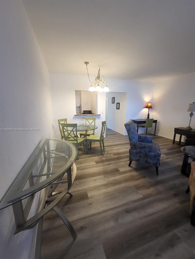 600 Layne Blvd Unit 118, Hallandale Beach, FL 33009 - living room featuring wood finished floors and a chandelier